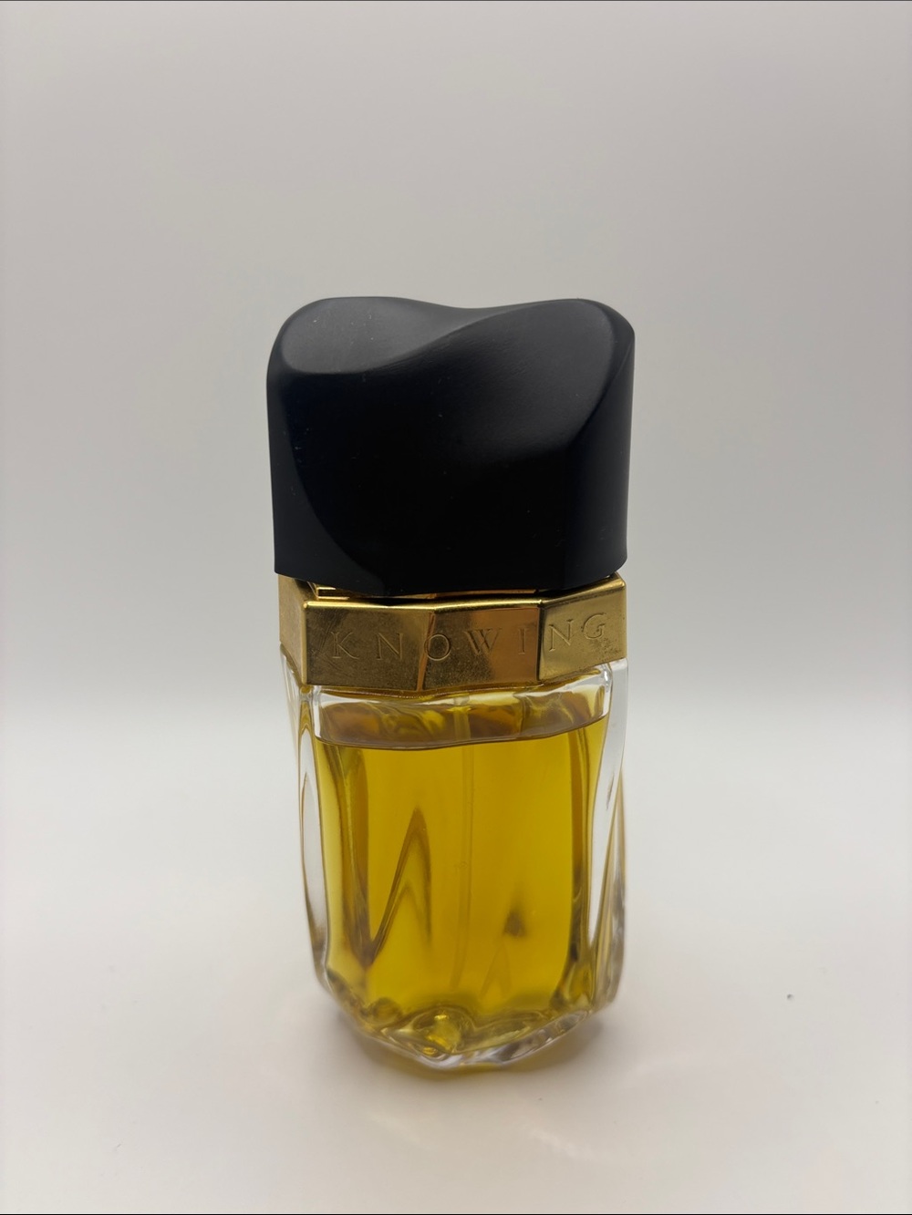 Estee Lauder Knowing Parfum Bottle in Black and Gold